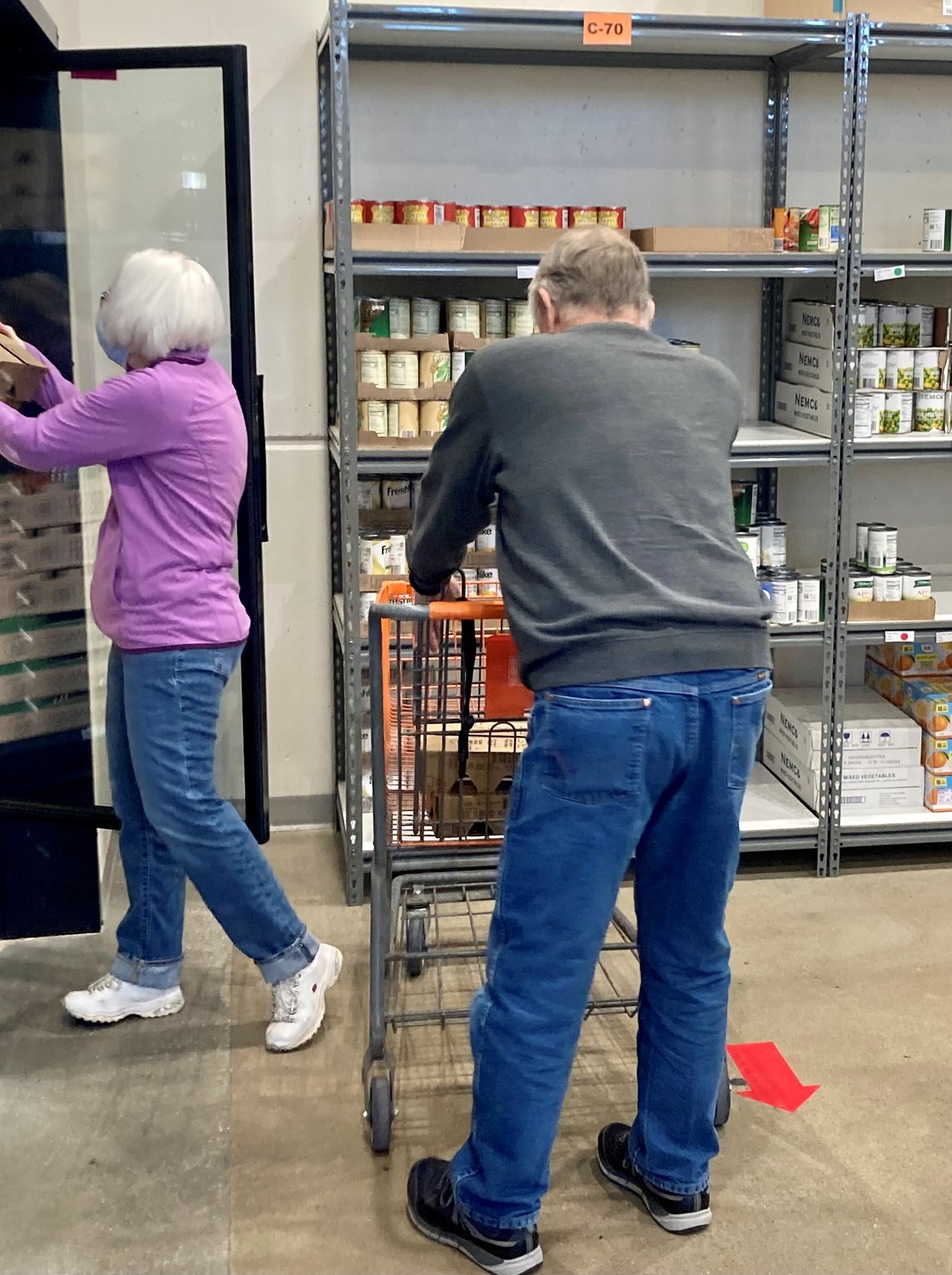 Members of the Joyful Servants Fraternity of the Secular Franciscan Order visit and assist in the food pantry at the Catholic Charities Center in Jefferson City in January 2023.
